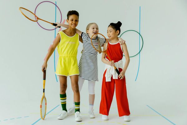 Group of diverse children practicing yoga in a bright studio.